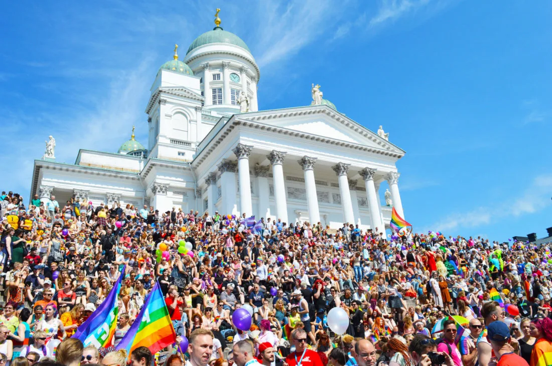 Gathering of the rainbow colored crowd for Gay Pride Helsinki LGBTQ Festival Parade © CoupleofMen.com