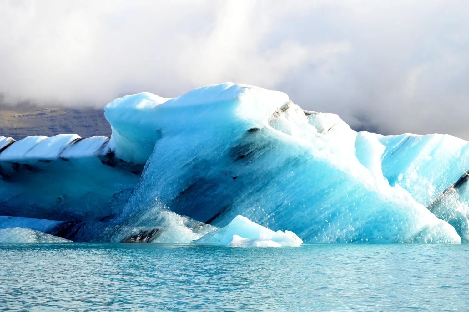 Beautiful cool blue colors of the icebergs | Zodiac Tour Glacier Lagoon Jökulsárlón © CoupleofMen.com