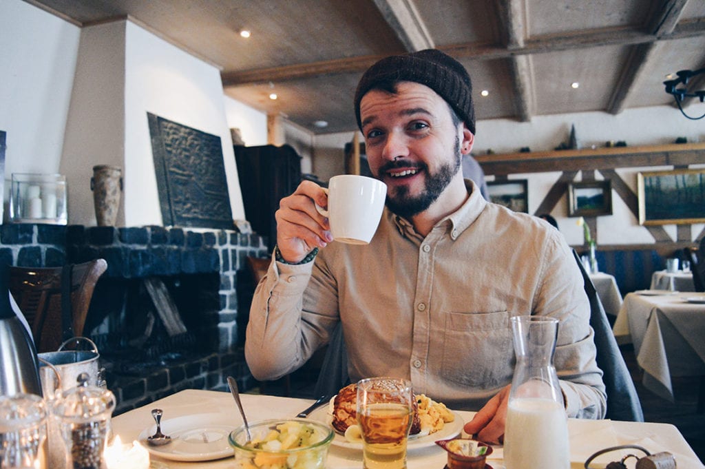 Karl enjoying his fresh coffee at Taufsteinhütte | Slumber Wine Barrel Taufsteinhütte © Coupleofmen.com
