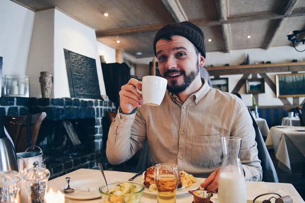 Karl enjoying his fresh coffee at Taufsteinhütte | Slumber Wine Barrel Taufsteinhütte © Coupleofmen.com