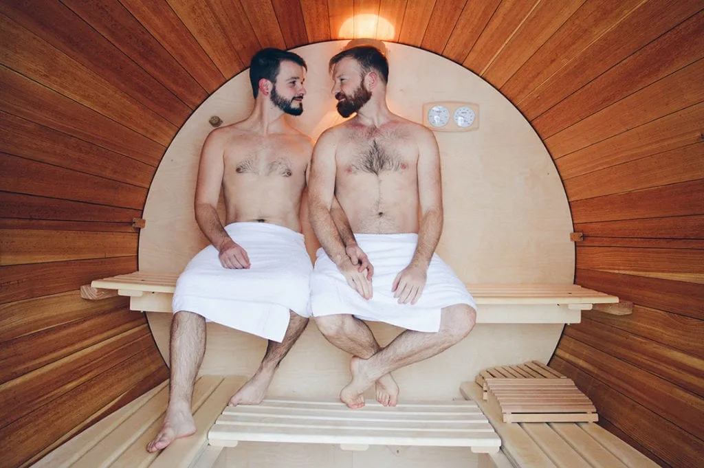 Two gay men in a Sauna BarrelSlumber Wine Barrel Taufsteinhütte Central Germany © CoupleofMen.com
