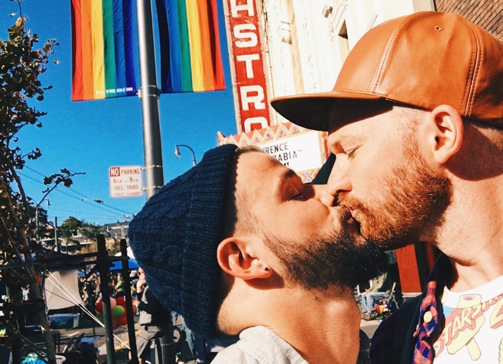Karl & Daan kissing in front Castro Theater | Our Photo Story Castro Street Fair San Francisco © CoupleofMen.com