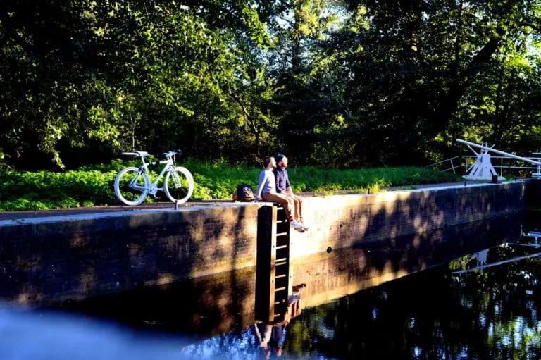 Gay Couple Biking Trips Amsterdam Forest © CoupleofMen.com