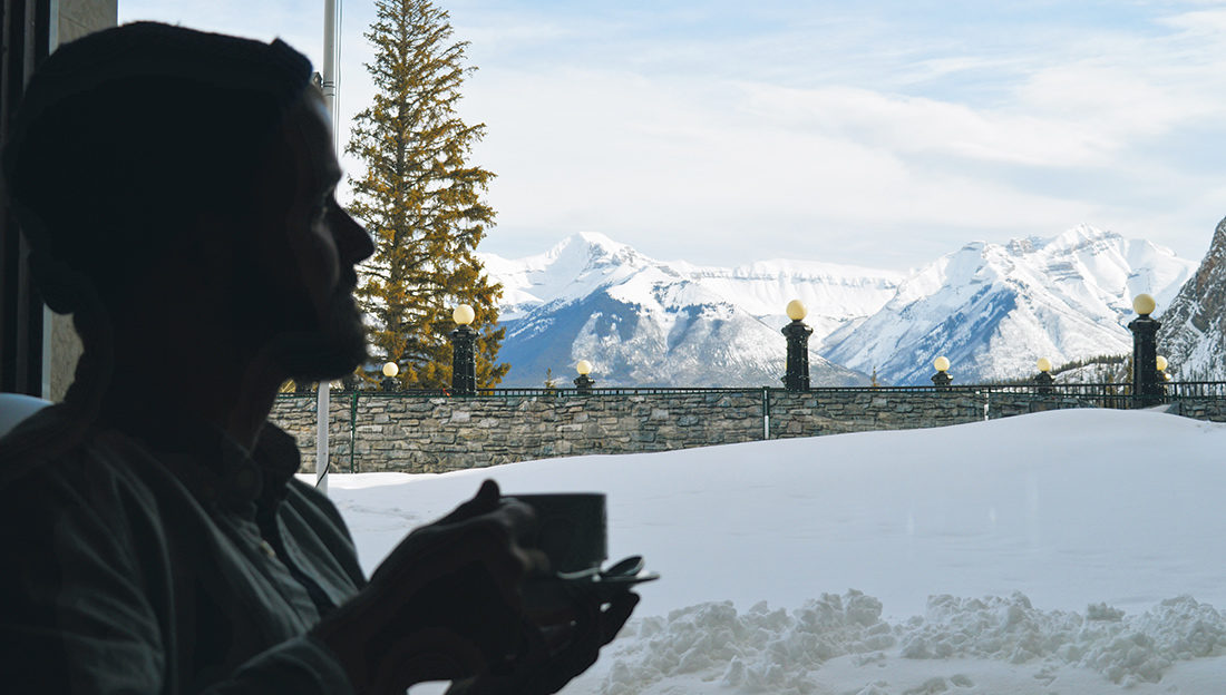 Karl having coffee enjoying the Mountain View | Fairmont Banff Springs Castle Hotel Gay-Friendly © CoupleofMen.com