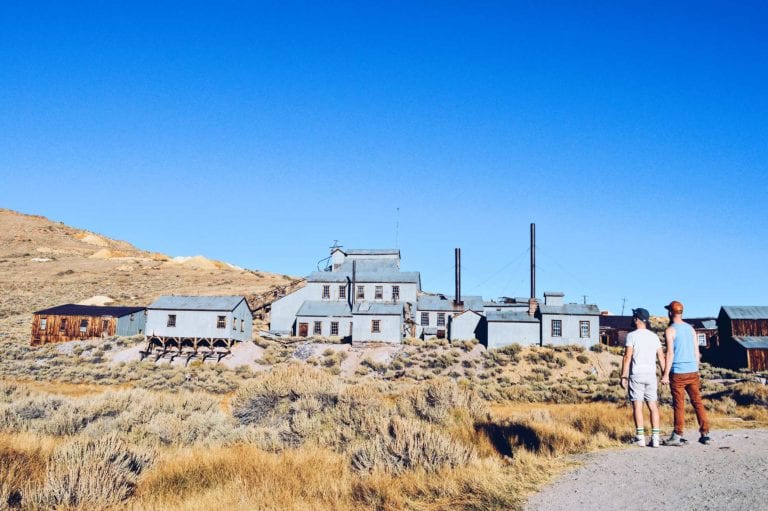 Gay Couple hand in hand gay travel blogger Ghost Town Bodie State Historic Park California © CoupleofMen.com