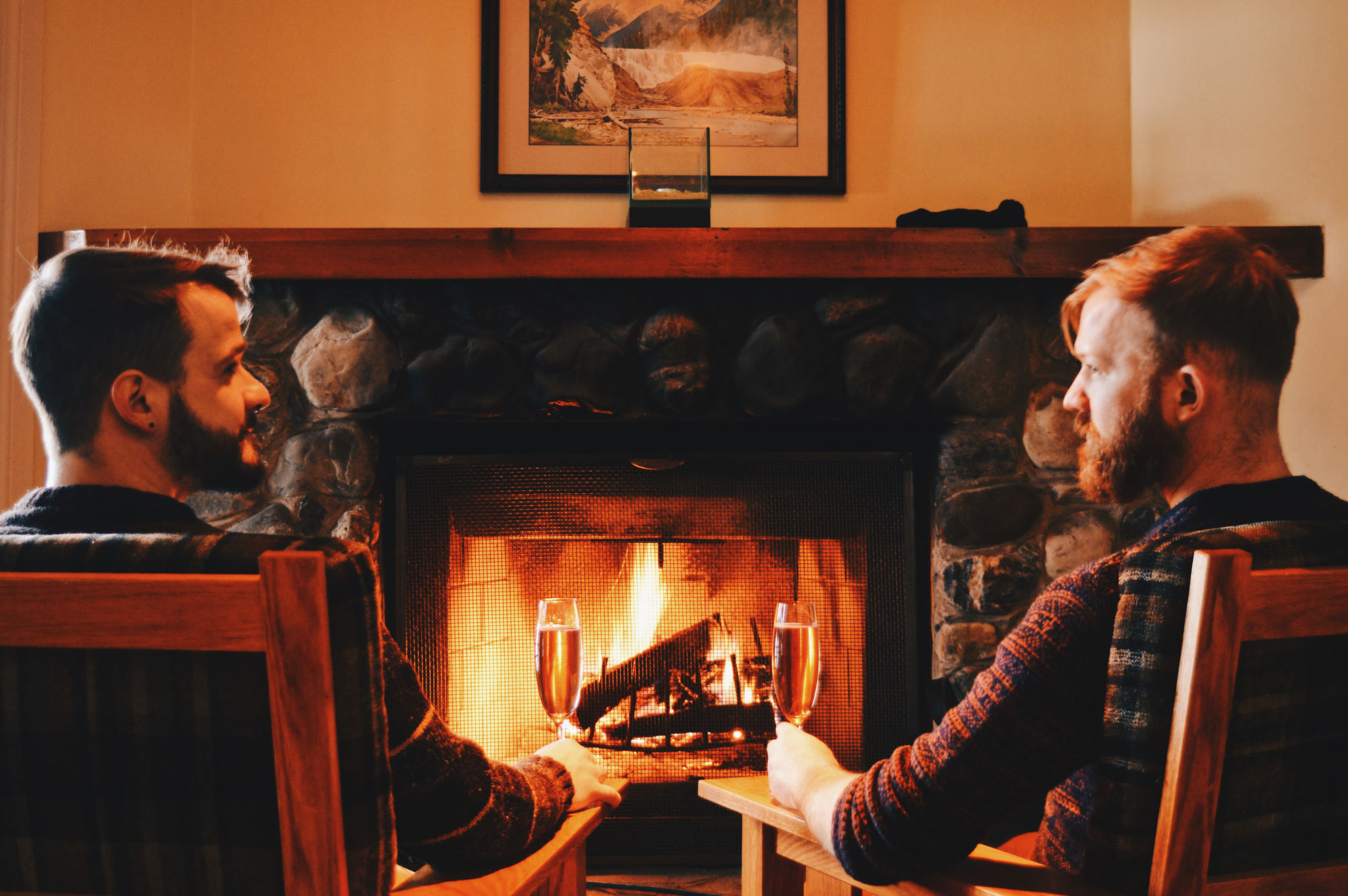 Relaxing in front of the open fireplace in our room | Emerald Lake Lodge gay-friendly accommodation © Coupleofmen.com