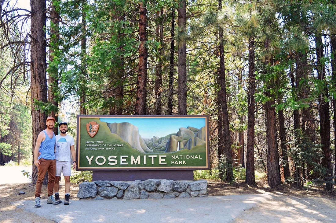 Happy to be here: Selfie at Yosemite National Park sign © CoupleofMen.com