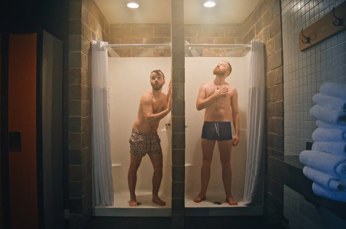 Gay Saunas in Europe Fun in the shower before going in the sauna | Emerald Lake Lodge gay-friendly © Coupleofmen.com