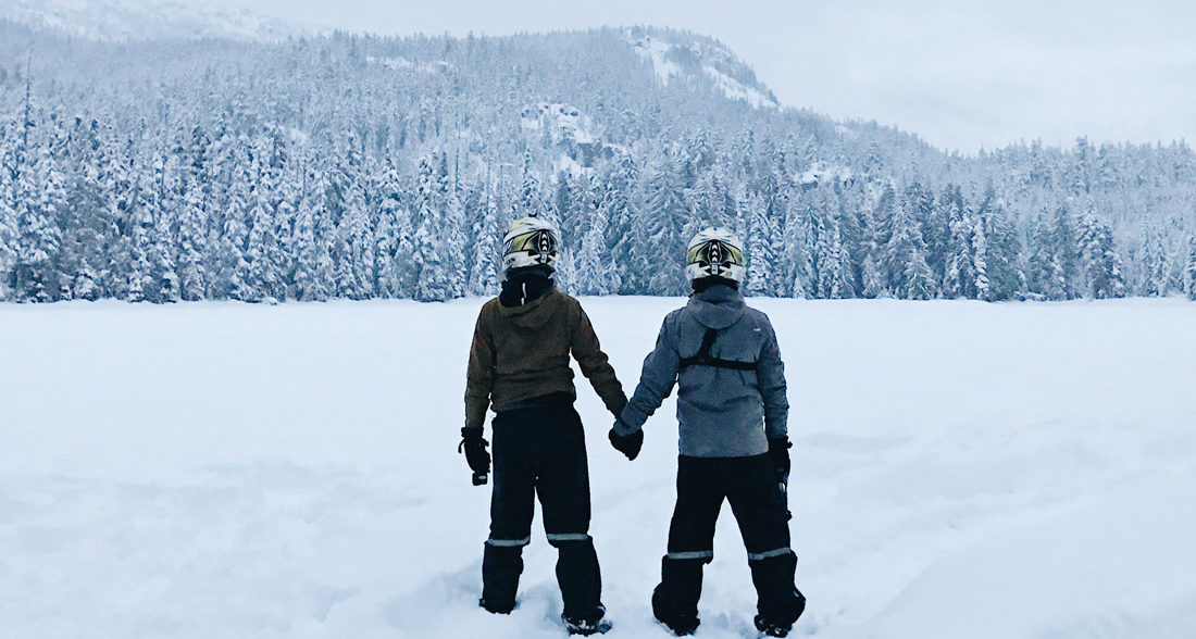 Hand-in-hand in the middle of winter wonderland nowhere | Zip Lining Snowmobiling TAG Whistler Gay-friendly © Coupleofmen.com