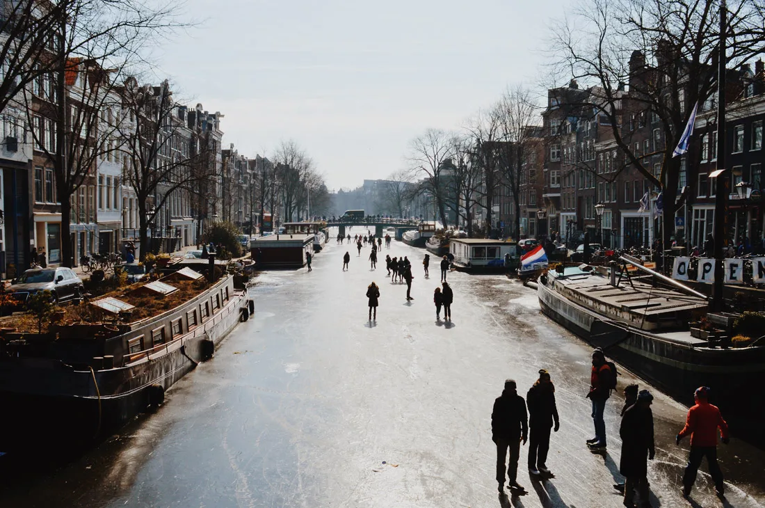 Winter on Amsterdam's frozen canals Ice-Skaters on Prinsengracht | Amsterdam Frozen Canals © Coupleofmen.com
