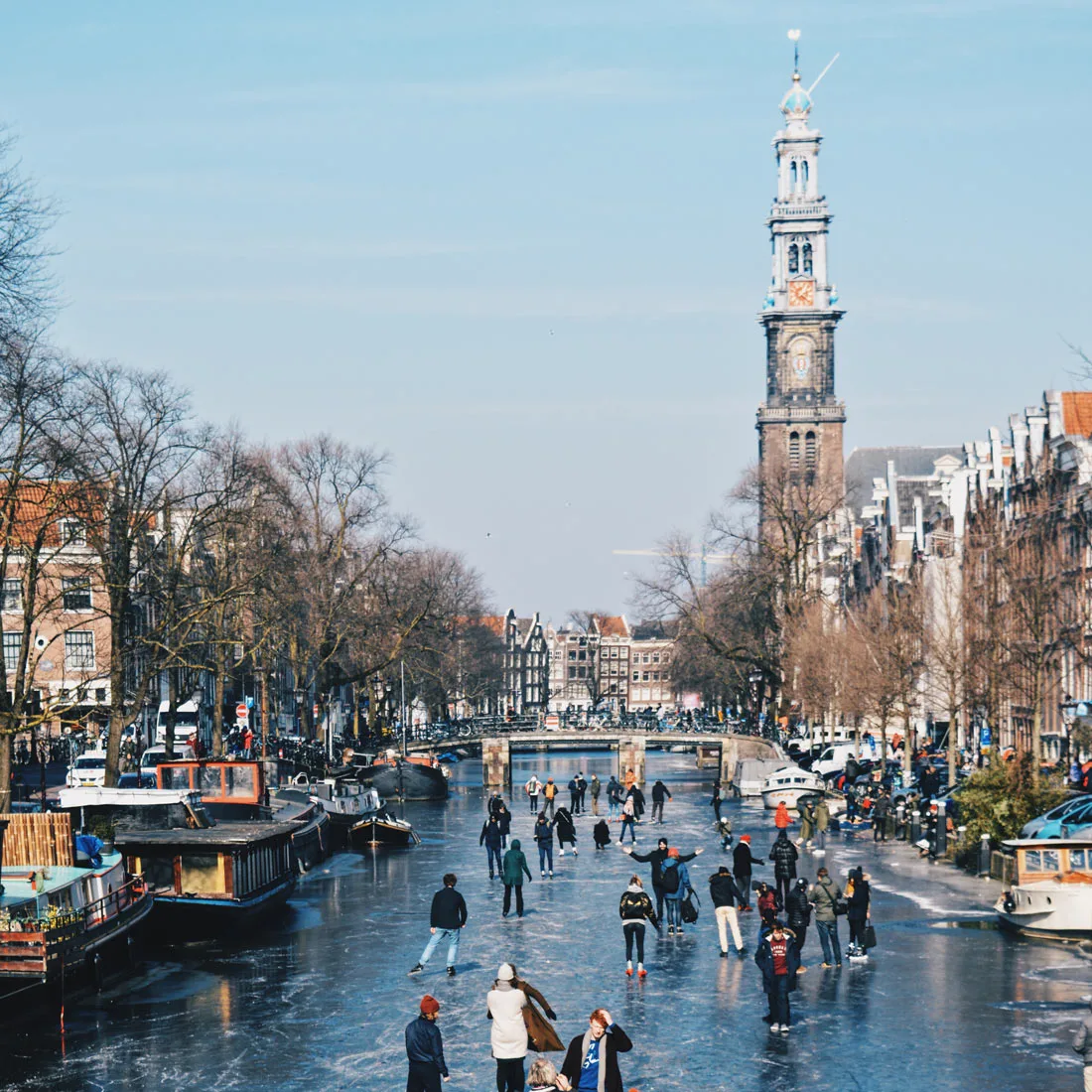 Winter on Amsterdam's frozen canals Frozen Prinsengracht with Westertoren | Amsterdam Frozen Canals © Coupleofmen.com