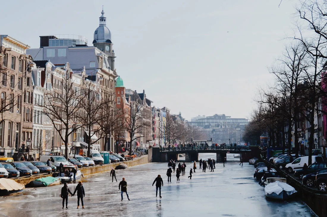 Winter on Amsterdam's Frozen Canals Ice Skaters on the Keizersgracht | Amsterdam Frozen Canals © Coupleofmen.com