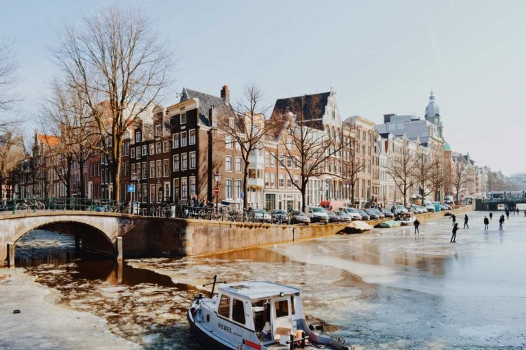 Amsterdam Frozen Canals Ice Skating on Grachten © Coupleofmen.com