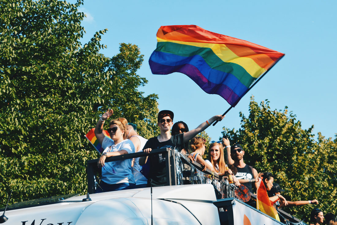 Queer participant waving the rainbow flag from a truck | CSD Berlin Gay Pride 2018 © Coupleofmen.com