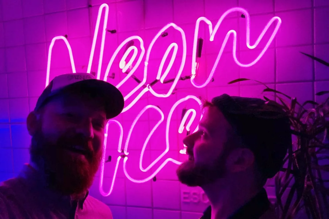 Gay Travel Journal Costa Rica Gay Selfie in front of the Neon Ice sign, our favorite gay bar in San José | Gay-friendly Costa Rica © Coupleofmen.com