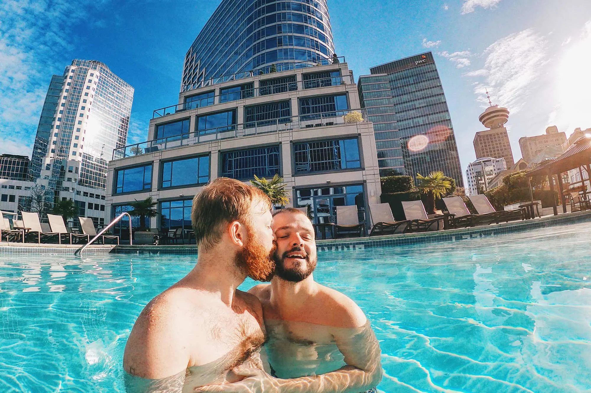 Gay Travel Blogger Whistler Pride Ski Festival Whistler Pride Gay Skiwoche A Gay Kiss in the Rooftop Pool of the Fairmont Waterfront after Whistler Pride and Ski Festival 2019 © Coupleofmen.com