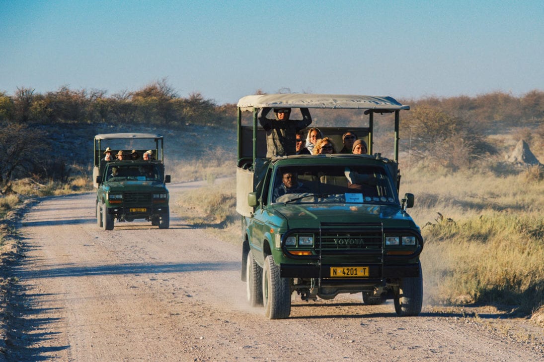 Game Drive Cars from the Mokuti Lodge on the gravel roads at Etosha in Namibia © Coupleofmen.com
