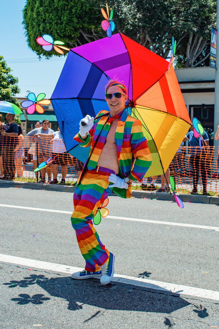 Isn't this rainbow man adorable? We love his rainbow umbrella the most! © Coupleofmen.com