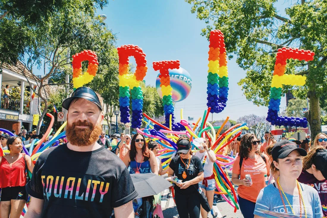 And look at this handsome ginger bearded man in front of the Pride sign (this caption was obviously written by Karl) © Coupleofmen.com