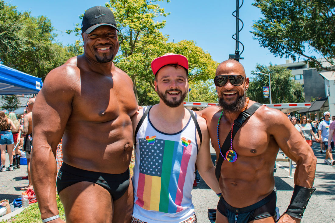 Two half naked black muscle guys arm-in-arm with Karl. Wait - Is Karl just so small or the other two guys just super tall and big? Sandwich muscle fun with © Coupleofmen.com