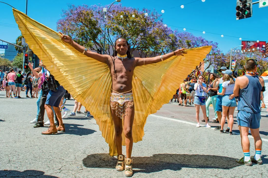 Fly like an Angel - Fly like a Butterfly - Just Fly! Half naked man with golden wings on the street in West Hollywood© Coupleofmen.com