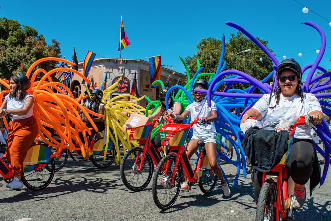 Pride comes in all colors and in all its facets even on bikes with balloons! © Coupleofmen.com