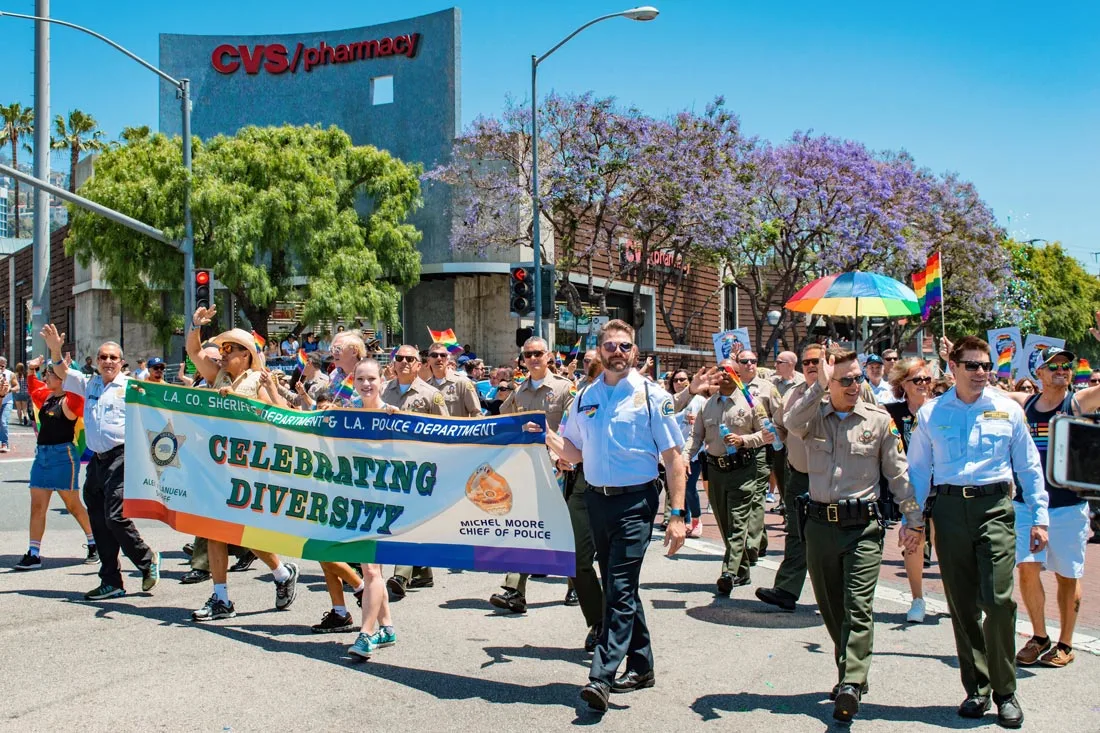 LAPD celebrating Diversity - We had to cry a little seeing LA Police men marching LA Pride hand-in-hand 2019 LA Pride West Hollywood © Coupleofmen.com