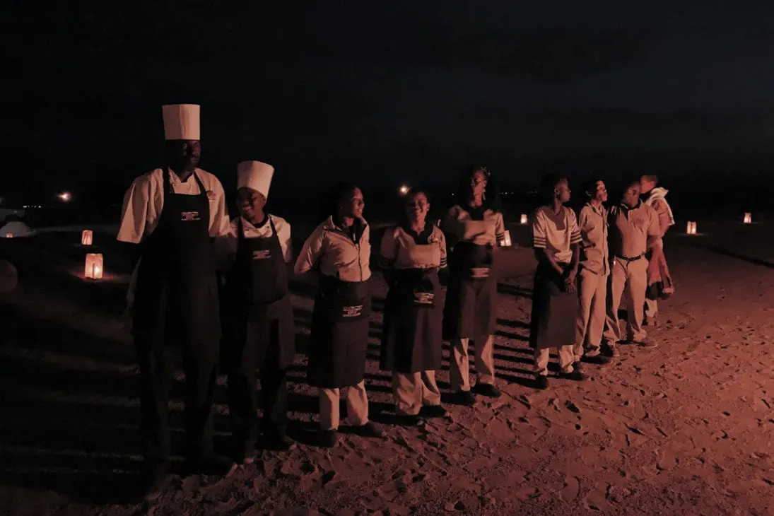 Welcome song by the staff of the Sossusvlei Lodge for our bush dinner under the stars © Coupleofmen.com