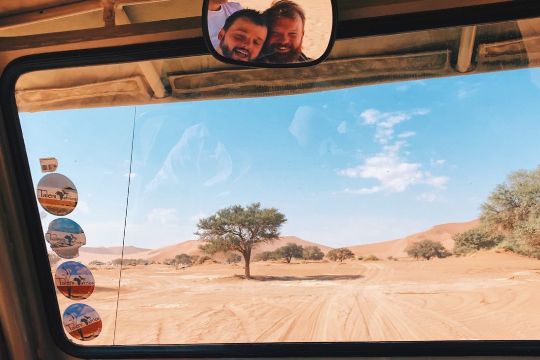 Fun selfie in the back mirrow during our drive to Sossusvlei area © Coupleofmen.com