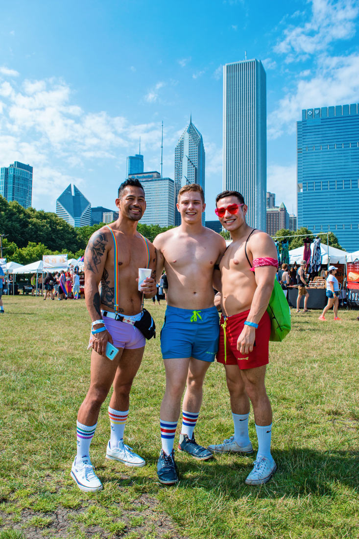 Chicago Gay City Tipps Half naked men getting ready for the Pride Park Festival on Saturday before Chicago Gay Pride Parade 2019 © Coupleofmen.com