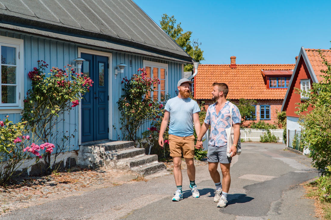 Gay Summer Road Trip Skåne Walking hand-in-hand around Kivik with its gorgeous Swedish houses © Coupleofmen.com