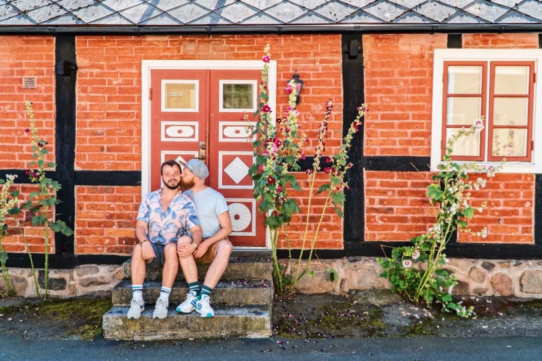 Gay Summer Road Trip Skåne Time for a gay kiss in Kivik with a gorgeous Swedish house © Coupleofmen.com