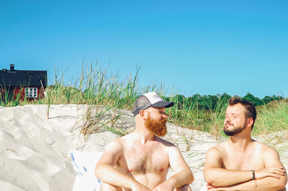 Gay Summer Road Trip Skåne Sunbathing together (naked) at the clothing optional gay beach of Sandhammaren © Coupleofmen.com