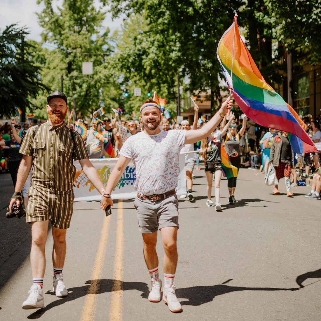 Out and proud: A couple of men walking hand in hand at Portland Pride © Coupleofmen.com