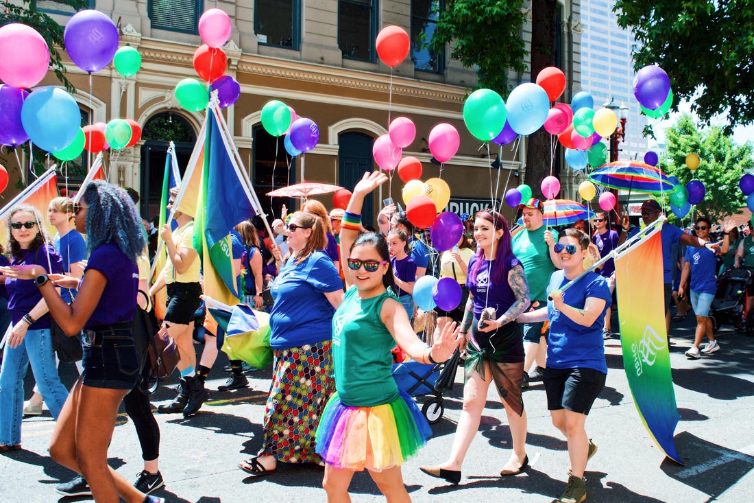 Summer colors, balloons, and happy face during Portland Pride Parade © Coupleofmen.com