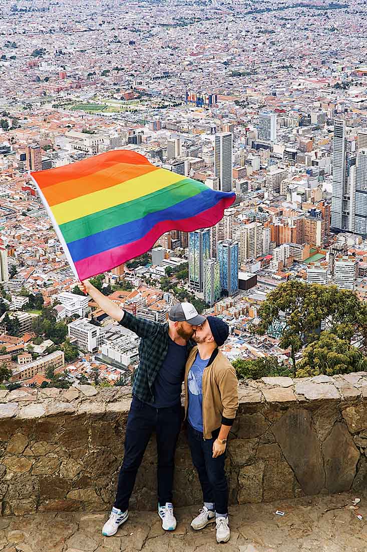Waving our rainbow flag above the Colombian metropolis © coupleofmen.com