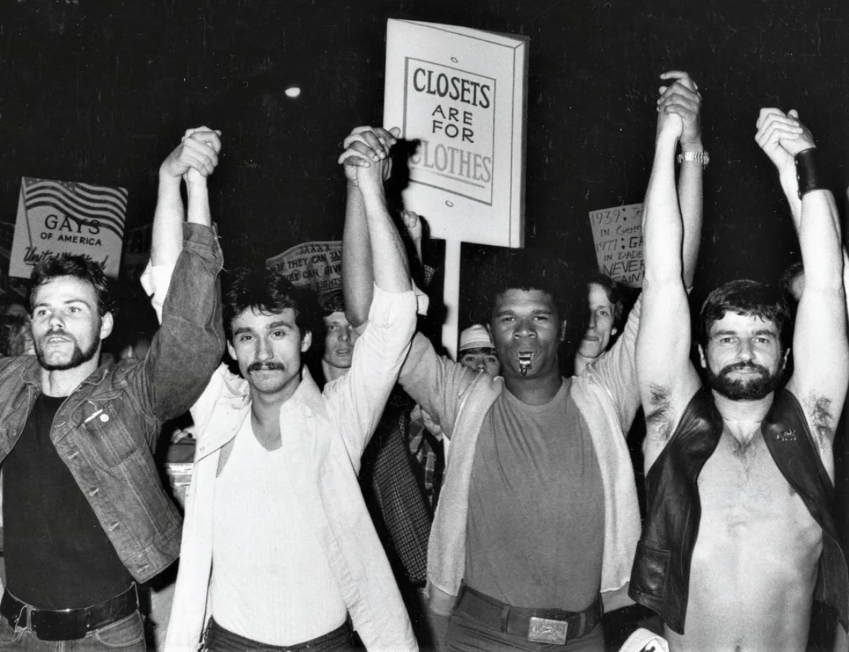 “CLOSETS ARE FOR CLOTHES,” activists (including Larry Rossiello, second from left) protest Anita Bryant’s successful campaign to repeal a Miami anti-discrimination ordinance, Sheridan Square, New York City, June 7, 1977. Photographer unknown, from the collection of @lgbt_history.