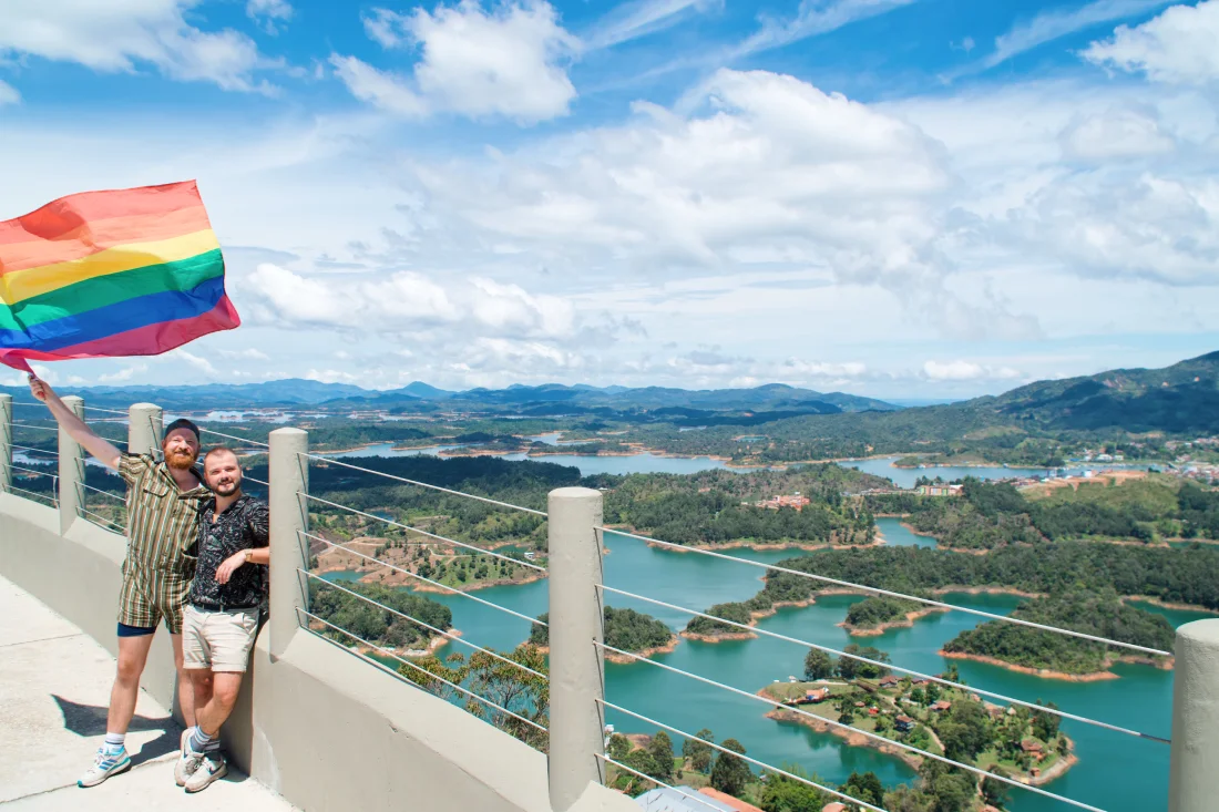 Gay Medellín Waving our rainbow flag from the top of El Pañol over water reservoir Peñol-Guatapé © Coupleofmen.com
