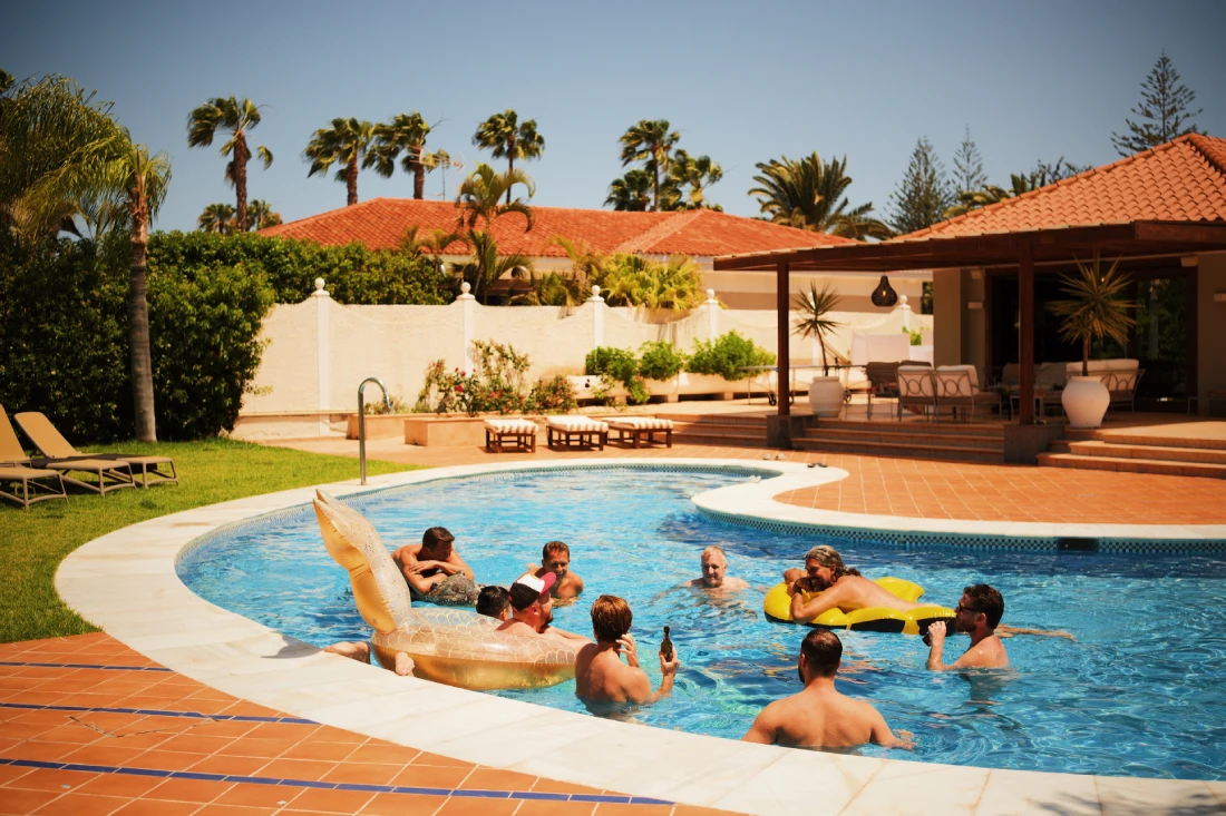 Enjoying the pool, the sun, and the drinks at the villa © Coupleofmen.com
