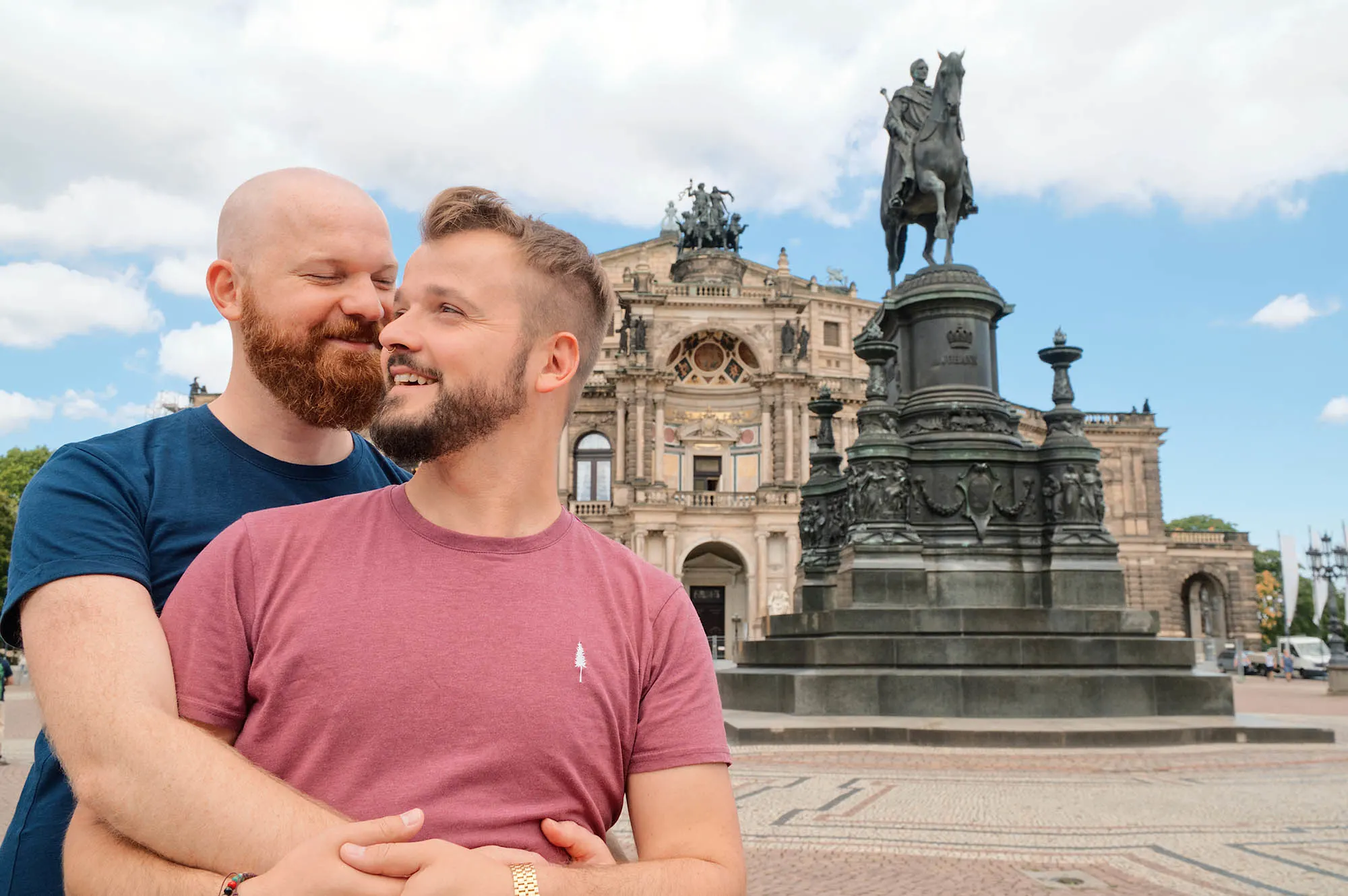 Dresden Gay City Trip: Gay Couple arm-in-arm in front of the Semper Opera © Coupleofmen.com