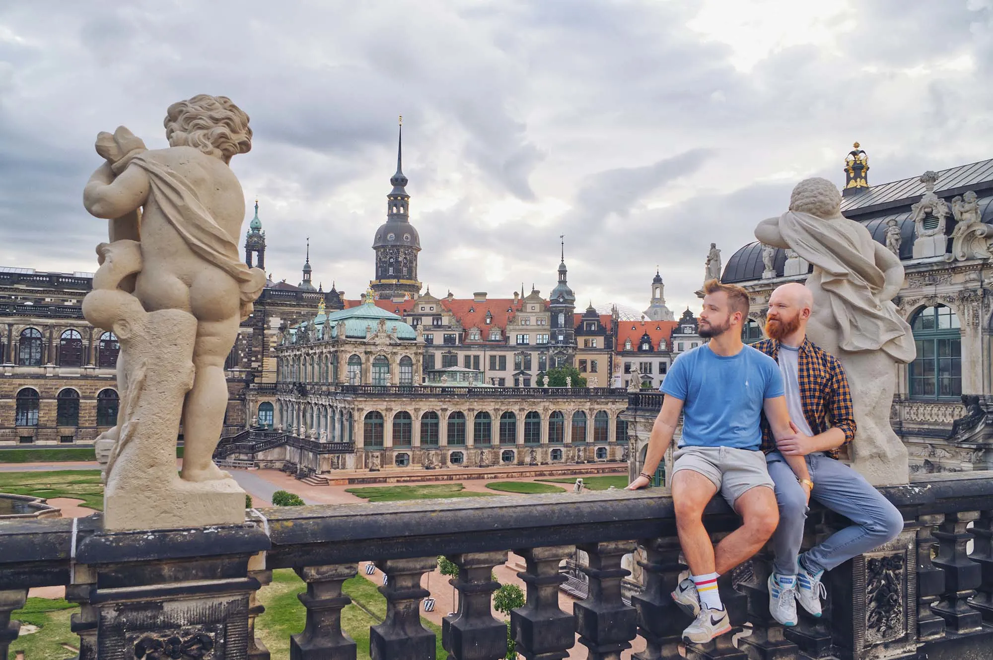 Dresden Gay City Trip: A Couple of Men enjoying the view over the historical old town city center in the Zwinger © Coupleofmen.com