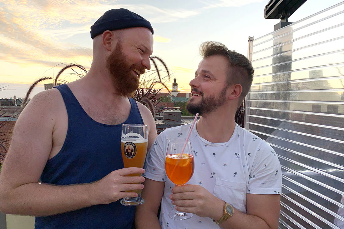 Munich Gay City Trip Perfect sun set moment with a drink at Deutsch Eiche Rooftop Bar © Coupleofmen.com