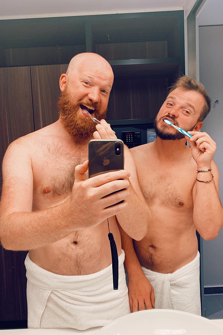 Bathroom fun - a couple of men brushing their teeth together - good morning Munich © Coupleofmen.com