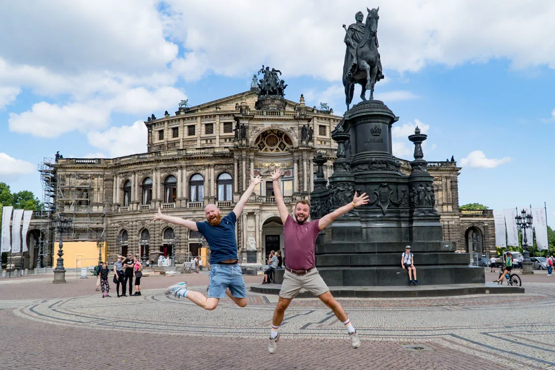 Trying our fun jumping selfies in front of the Semper Opera, Dresden-Altstadt © Coupleofmen.com