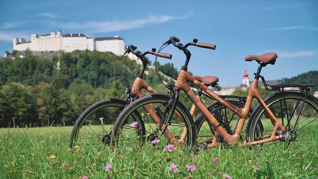 Rental bikes from the Arte Hotel with the Fortress Hohensalzburg in the background © Coupleofmen.com