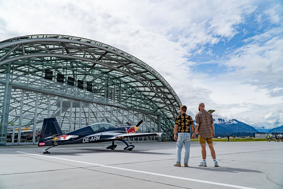 Hand-in-Hand in front of Hangar 7 to explore more of Salzburg's modern side © Coupleofmen.com