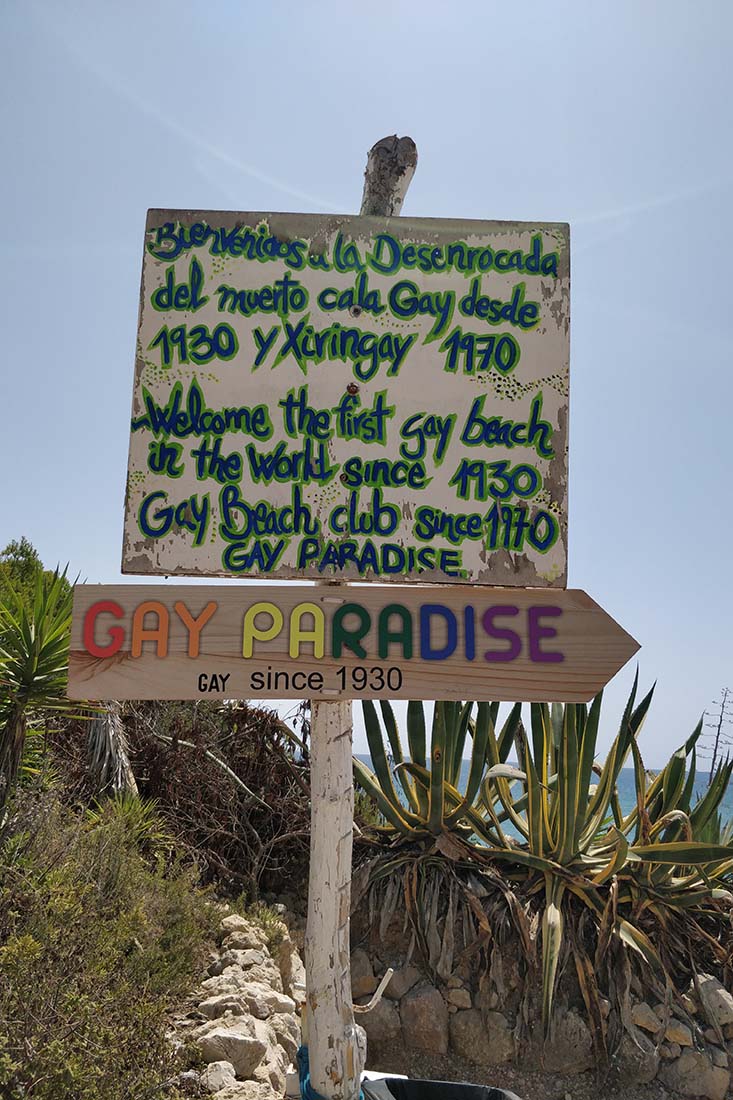 Colorful signs to Sitges Gay Beach Playa del Hombre Muerto