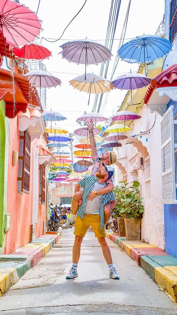 Gay Reise Cartagena Umbrellas on the beautiful street Calle Angosto in Cartagena © Coupleofmen.com