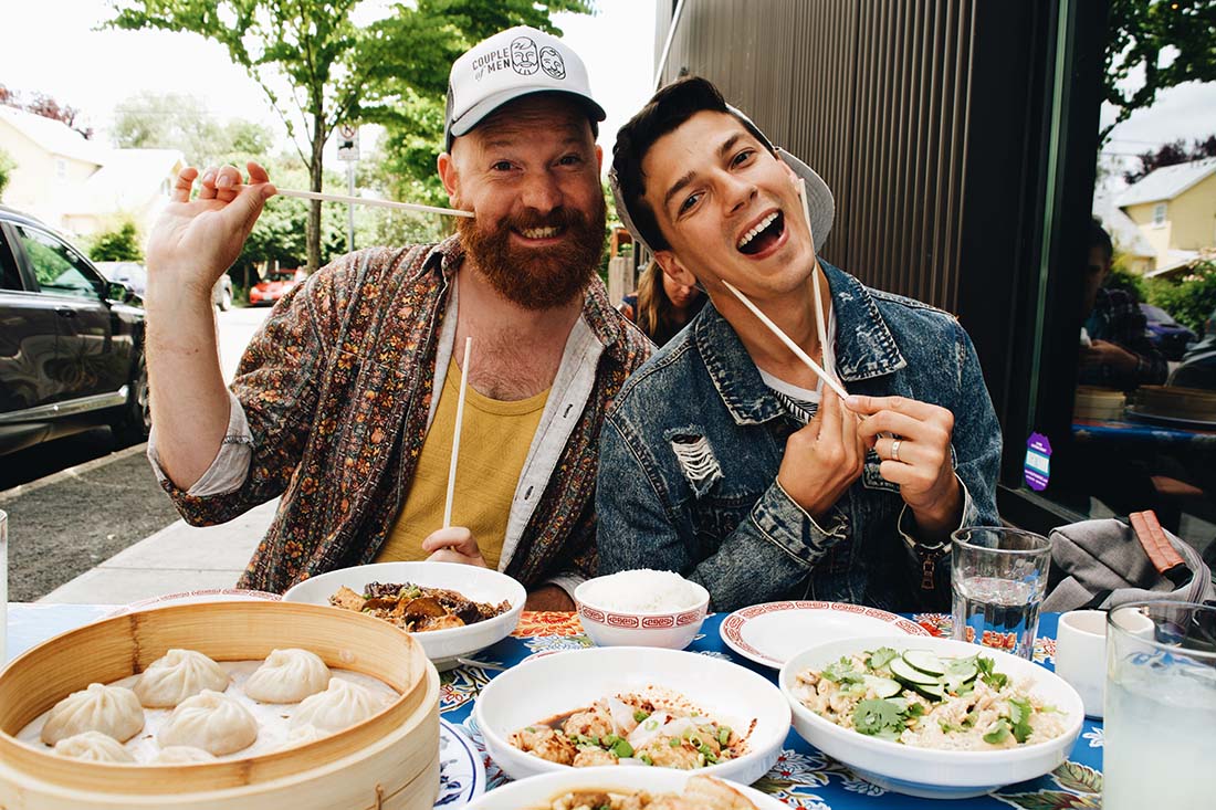 Daan and Matthew having fun with their chopsticks during lunch at XLB in Portland © Coupleofmen.com