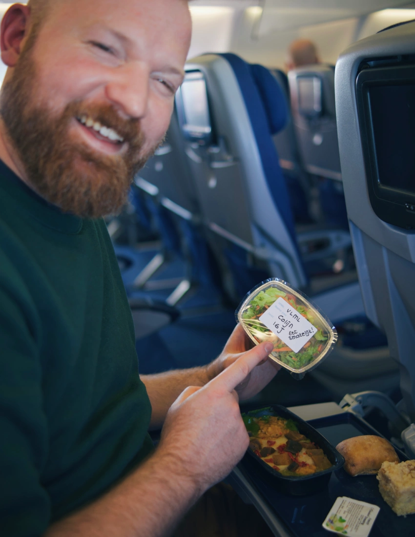 Daan is happy about his vegetarian dishes served on our way to Miami © Coupleofmen.com